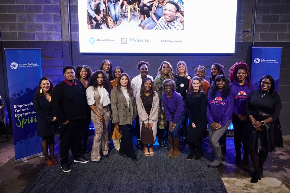 A group of Atlanta business owners on stage for the first-ever graduation of a Beltline Business Ventures class. (Photo Credit: Erin Sintos)